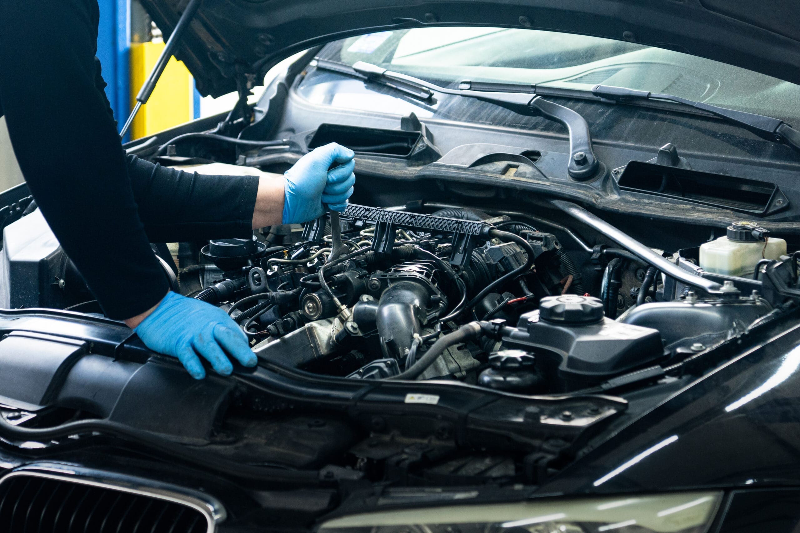 Mechanic working on a car in a garage